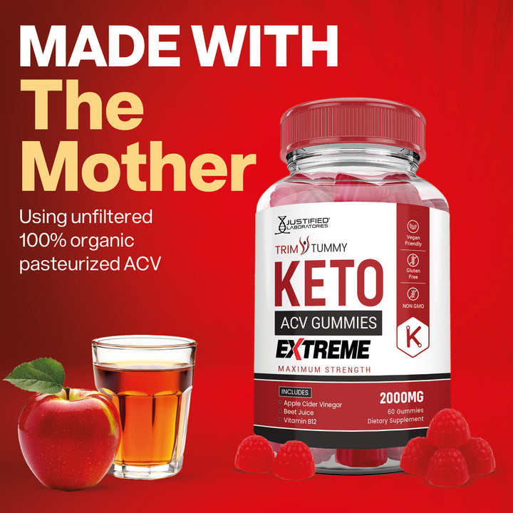 Keto ACV gummies bottle with apple, glass of juice, and raspberries on a red background